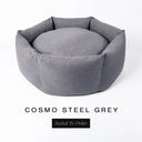 A luxury donut dog bed in cool steel grey Cosmo fabric, suitable for all breeds of dogs, with cosy high-wall sides and a deep-filled luxury mattress inside, on a white background with the text 'COSMO STEEL GREY' and 'Styled To Order' below.