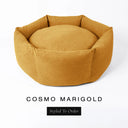 A luxury donut dog bed in warm golden marigold Cosmo fabric, suitable for all breeds of dogs, with cosy high-wall sides and a deep-filled luxury mattress inside, on a white background with the text 'COSMO MARIGOLD' and 'Styled To Order' below.