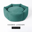 A luxury donut dog bed in deep teal green Cosmo fabric, suitable for all breeds of dogs, with cosy high-wall sides and a deep-filled luxury mattress inside, on a white background with the text 'COSMO LAGOON' and 'Styled To Order' below.