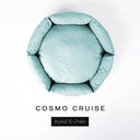 A top-down view of a pale seafoam blue luxury donut dog bed with high-wall padded sides and a round mattress inside, on a white background with the text 'COSMO CRUISE' and a black 'Styled To Order' label below.