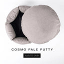 A luxury donut dog bed in warm putty grey Cosmo fabric seen from above with the round mattress lifted out of the high-wall donut bed sides, on a white background with the text 'COSMO PALE PUTTY' and a black 'Styled To Order' label.