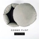 A luxury donut dog bed in pale flint grey-green Cosmo fabric seen from above with the round mattress lifted out of the high-wall donut bed sides, on a white background with the text 'COSMO FLINT' and a black 'Styled To Order' label.
