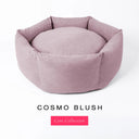 A blush pink premium donut style dog bed, suitable for all breeds of dogs, with cosy high-wall dog bed sides and a deepfilled luxury mattress inside , on a white background with the text 'COSMO BLUSH' and 'Core Collection' below.