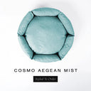 A top-down view of a pale aqua seafoam luxury donut dog bed with high-wall padded sides and a round mattress inside, on a white background with the text 'COSMO AEGEAN MIST' and a black 'Styled To Order' label below.