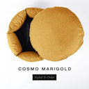 A luxury donut dog bed in warm golden marigold Cosmo fabric seen from above with the round mattress lifted out of the high-wall donut bed sides, on a white background with the text 'COSMO MARIGOLD' and a black 'Styled To Order' label.