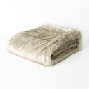Picture of a folded Oatmeal faux fur dog blanket taken on a white backdrop.