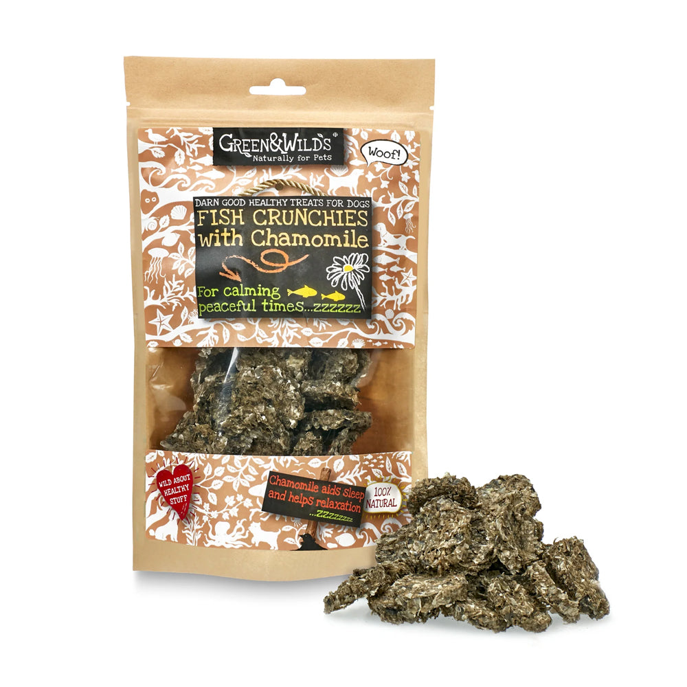 Packaged Green & Wild's Fish Crunchies with Chamomile Dog Treats with some loose Fish Crunchies next to the package on a white background