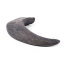 A 100% natural black buffalo horn, long-lasting tough dog chew and dog boredom buster, on a white backdrop.