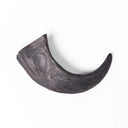 A 100% natural black buffalo horn tough dog chew and dog boredom buster on a white backdrop.