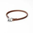 A BROWN handcrafted, fine leather house collar for dogs - a loose, leather dog collar for dog ID tags that can be worn at home to keep a tag on the dog.