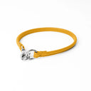 A BRIGHT YELLOW handcrafted, fine leather house collar for dogs - a loose, leather dog collar for dog ID tags that can be worn at home to keep a tag on the dog.