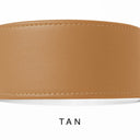 A close-up of a hand-crafted tan leather dog collar with visible stitching, made with fine Italian Calf leather in England, labelled 'TAN' below on a white background.
