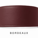 A close-up of a bespoke BURGUNDY leather dog collar with visible stitching, made with fine Italian Calf leather, labelled 'BORDEAUX' below on a white background.