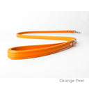 A calf leather dog lead in Orange Peel taken on a white backdrop. Handmade to order.