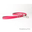 A calf leather dog lead in Raspberry Pink taken on a white backdrop. Handmade to order.