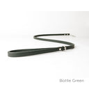 A calf leather dog lead in Bottle Green taken on a white backdrop. Handmade to order.