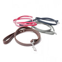 A collection of calf leather dog leads in various colours and widths taken on a white backdrop. Handmade to order. 
