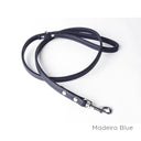 A calf leather dog lead in Madeira Blue taken on a white backdrop. Handmade to order.