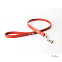 A calf leather dog lead in Ruby taken on a white backdrop. Handmade to order.