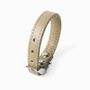 A PALE BEIGE handcrafted leather puppy dog collar, made to order for the perfect fit for any puppy dog.
