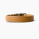 A TAN handcrafted leather puppy dog collar, made to order for the perfect fit for any puppy dog.
