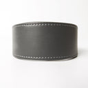 Another closeup picture showing a Whippet Collar from the front detailing the distinctive wider part of the collar that protects the slender necks of sighthounds. The handmade calf leather collar is taken on a white backdrop.
