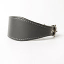 A closeup picture showing a Whippet Collar from a side view. The handmade calf leather collar is taken on a white backdrop.