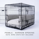 Black wire dog dog crate with a luxury dog crate mattress and crate bed bumper set in pale beige/grey on a white backdrop.