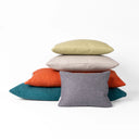 Stack of colorful small cushions - Mini-Bolster Pads - pet bed accessories designed for dog beds for extra comfort and support, by designers Charley Chau.