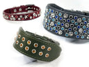 Three Petiquette leather dog collars with Swarvski cruystal embellishements on a  white background: a burgundy collar with red and clear crystals, a blaack collar with blue, silver, and clear crystals, and an olive green collar with amber crystals.