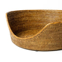 Clsoe up of a luxury rattan dog basket showing the intrictae woven detail.