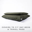 A cushioned but  tough, water-resistant dog bed and and a slimline dog crate mattress in olive green dry wax cotton canvas, a fabric that is highly water-resistant and resilient as well as machine washable.