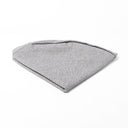 Folded Spare Dog Bed Cover for the round dog bed mattress inside the Charley Chau donut dog bed in grey on a white backdrop.