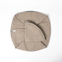 A folded Spare Dog Bed Cover set for the donut bed sides of a Charley Chau luxury Ducky Donut Dog Bed & Round Mattress in beige on a white backdrop.