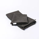 Folded Spare Covers for Charley Chau's Luxury Bliss Bolster Dog Bed in a dark brown/black woven upholstery fabric
