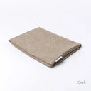Folded Spare Cover for Charley Chau's Luxury Bliss Bolster Dog Bed in a beige woven upholstery fabric.