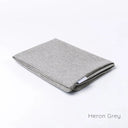 Folded Spare Cover for Charley Chau's Luxury Bliss Bolster Dog Bed in a grey woven upholstery fabric.