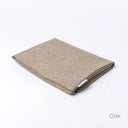 Folded Spare Dog Bed Cover for Charley Chau luxury dog beds in a heavy duty upholstery fabric with a woven texture  in beige on a white back drop.