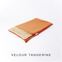 A folded spare dog bed cover to fit Charley Chau Snuggle Dog Beds and Burrow Bags with bright orange outer cover in upholstery-quality Velour and plush cream faux-fur lining on a white backdrop.