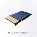 A folded spare dog bed cover to fit Charley Chau Snuggle Dog Beds and Burrow Bags with dark navy blue outer cover in upholstery-quality Velour and plush cream faux-fur lining on a white backdrop.
