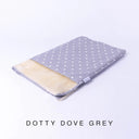 A folded spare dog bed cover to fit Charley Chau Snuggle Dog Beds and Burrow Bags with dove grey polka dot outer cover in Dotty Cotton and plush cream faux-fur lining on a white backdrop.
