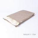A spare Snuggle Bed / Burrow Bag Cover in the Classic Blanket Top style in Weave II Oak taken on a white backdrop.