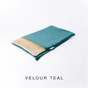 A folded spare dog bed cover to fit Charley Chau Snuggle Dog Beds and Burrow Bags with deep teal outer cover in upholstery-quality Velour and plush cream faux-fur lining on a white backdrop.