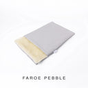 A folded spare dog bed cover to fit Charley Chau Snuggle Dog Beds and Burrow Bags with pale grey outer cover in woven wool texture upholstery-quality Faroe and plush cream faux-fur lining on a white backdrop.
