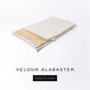 A folded spare dog bed cover to fit Charley Chau Snuggle Dog Beds and Dog Burrow Bags with pale beige outer cover in upholstery-quality Velour and plush cream faux-fur lining on a white backdrop.