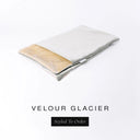 A folded spare dog bed cover to fit Charley Chau Snuggle Dog Beds and Dog Burrow Bags with pale icy grey outer cover in upholstery-quality Velour and plush cream faux-fur lining on a white backdrop.