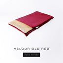A folded spare dog bed cover to fit Charley Chau Snuggle Dog Beds and Dog Burrow Bags with brick red outer cover in upholstery-quality Velour and plush cream faux-fur lining on a white backdrop.