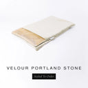 A folded spare dog bed cover to fit Charley Chau Snuggle Dog Beds and Dog Burrow Bags with pale stone grey outer cover in upholstery-quality Velour and plush cream faux-fur lining on a white backdrop.