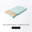 A folded spare dog bed cover to fit Charley Chau Snuggle Dog Beds and Dog Burrow Bags with pale turquoise blue outer cover in upholstery-quality Velour and plush cream faux-fur lining on a white backdrop.