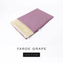 A folded spare dog bed cover to fit Charley Chau Snuggle Dog Beds and Dog Burrow Bags with dusty mauve outer cover in woven wool texture upholstery-quality Faroe and plush cream faux-fur lining on a white backdrop.